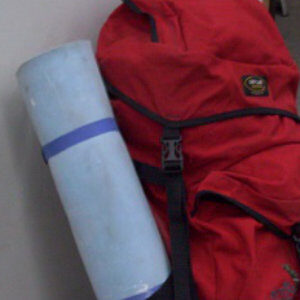 Blue rolled foam mat with red Back pack